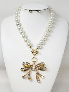 GOLD PEARL NECKLACE SET BOW CLEAR STONES ( 30140 GCL )